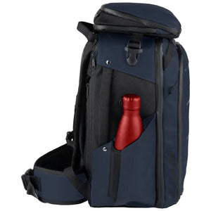 A navy blue and black backpack with a red bottle in its front pocket, shown on a plain white background.