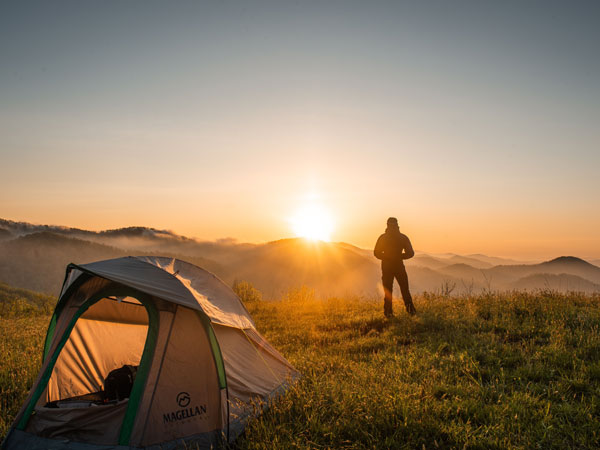 Man standing with tent