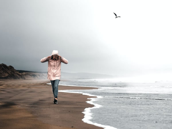 Woman walking on the beach