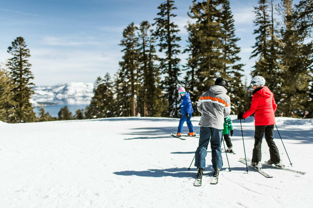 Four people on a ski trail