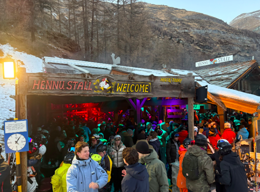Skiers and boarders gathered at apres ski bar in zermatt
