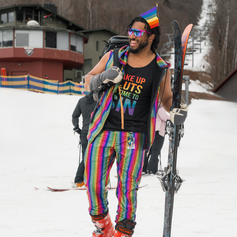 Male skier dressed in festive outfit for spring skiing festivites