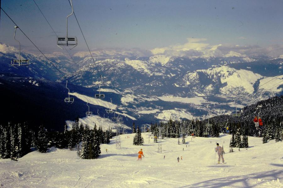 People skiing under chairlift at whistler mountain canada