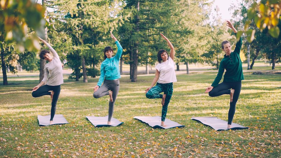 Women in outdoor yoga class
