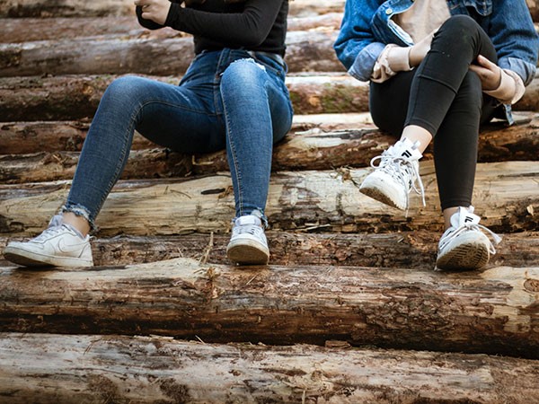 2 people sitting outside